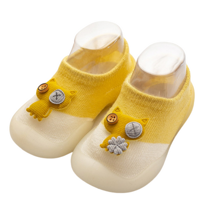Infant anti-slip walker shoes featuring a charming cat design, ideal for baby's first steps and comfortable wear.