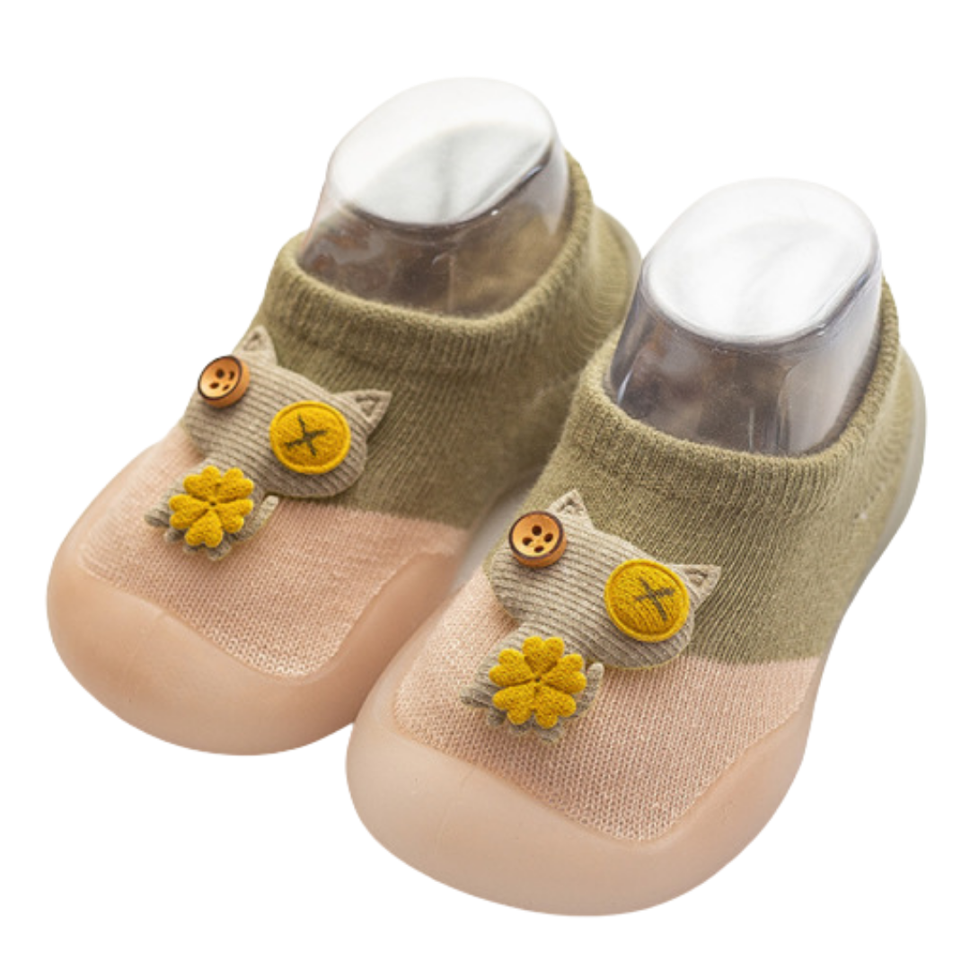 Soft-soled baby walker shoes with an anti-slip grip and playful cat design, perfect for new walkers.