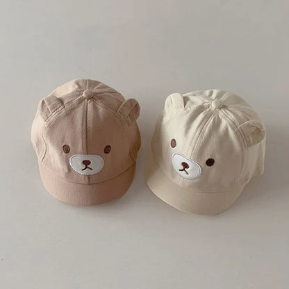 Adorable baby baseball cap with bear ears, adjustable strap for infant sun protection in cotton blend.