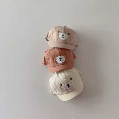High-quality cotton blend baby cap with bear ears, designed for comfort and sun protection.