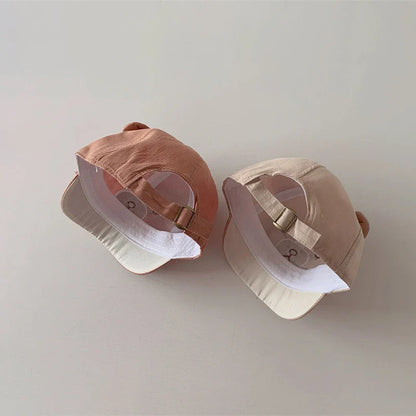 Chic infant headwear: bear ears baseball cap in a durable cotton blend, ensuring stylish sun safety.