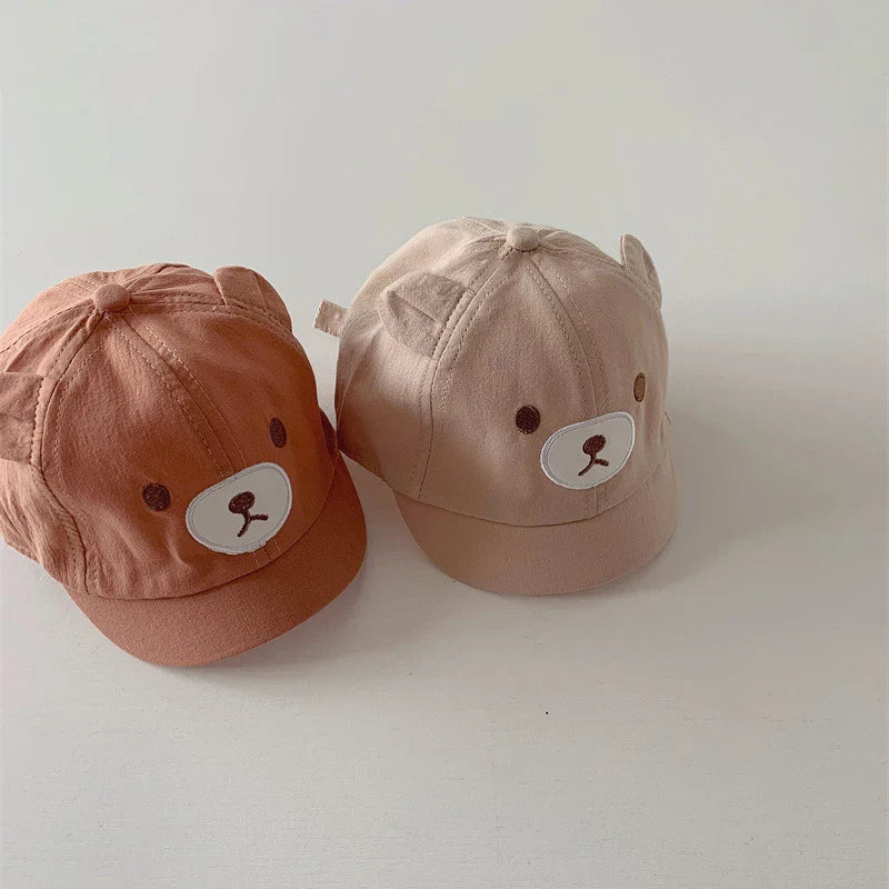 Stylish baby hat: bear ears baseball cap, offering adjustable fit and essential sun protection for infants.