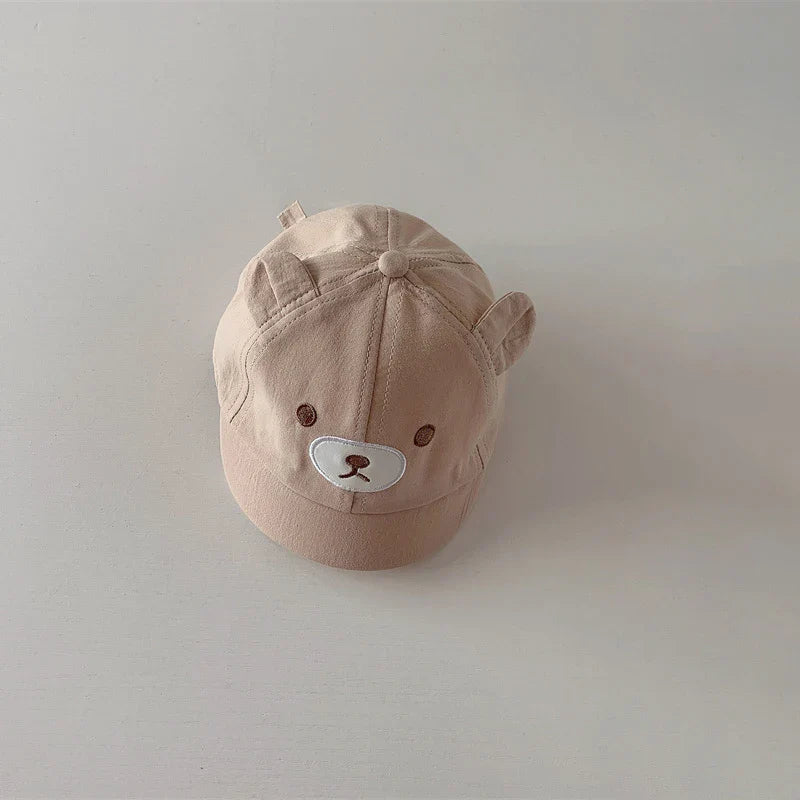 Toddler fashion accessory: adjustable baseball cap with bear ears, perfect for sunny days.