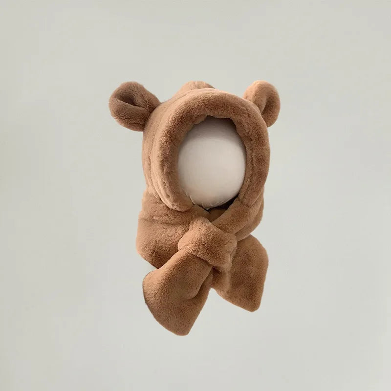 Close-up of a knitted bear ear winter hat with integrated scarf for babies and toddlers.