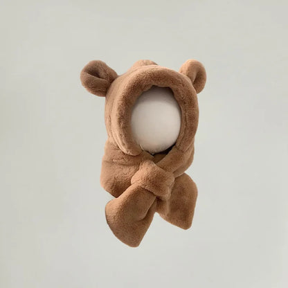 Close-up of a knitted bear ear winter hat with integrated scarf for babies and toddlers.