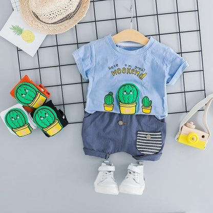 Cactus print detail on a white baby summer outfit, perfect for both baby boys and girls.