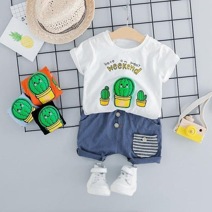 White baby summer outfit with cute smiling cactus print, short sleeve for boys and girls.