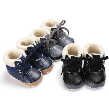 Close-up of fluffy baby winter shoes, cozy soft sole for pre-walkers, unisex design