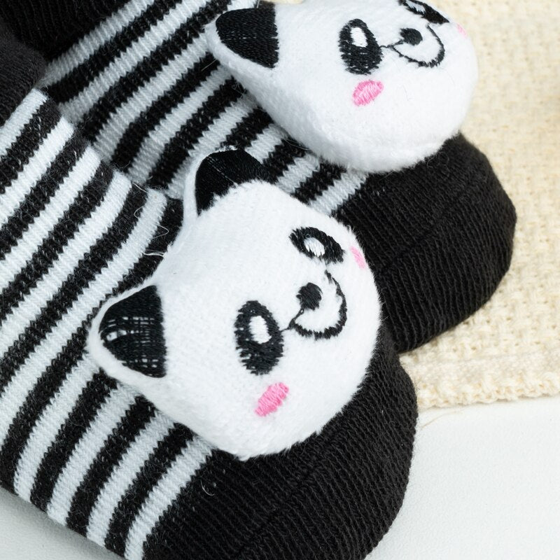 Back view of non-slip cotton infant socks with cartoon doll detail on the heel