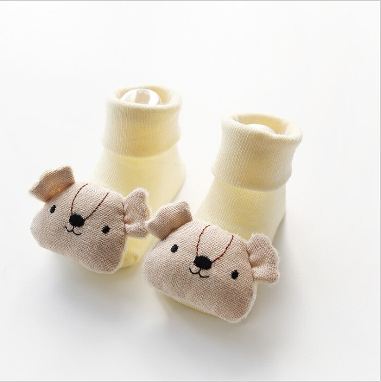 Newborn non-slip cotton socks featuring a playful cartoon doll, perfect for baby fashion
