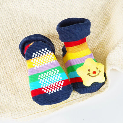 Close-up of a baby cartoon doll cotton sock, highlighting non-slip sole and soft texture