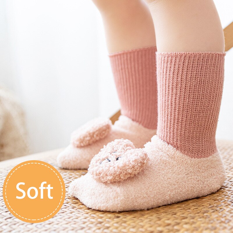 Charming baby monkey cartoon non-slip terry socks, unisex design for ages 0-36 months.