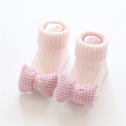 Close-up of baby cartoon non-slip cotton floor socks showing grip details