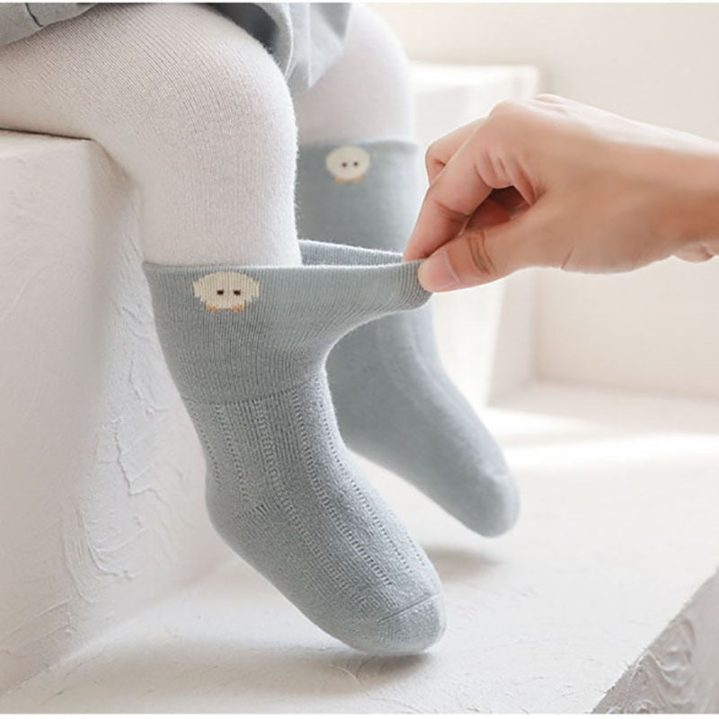 Assortment of colorful cartoon thick socks for infants and toddlers, cozy and stylish baby apparel