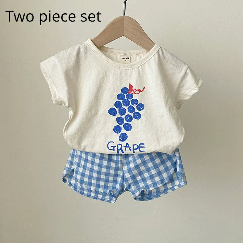 Vibrant orange baby sleeveless cotton pajamas with a whimsical cartoon design for warm nights