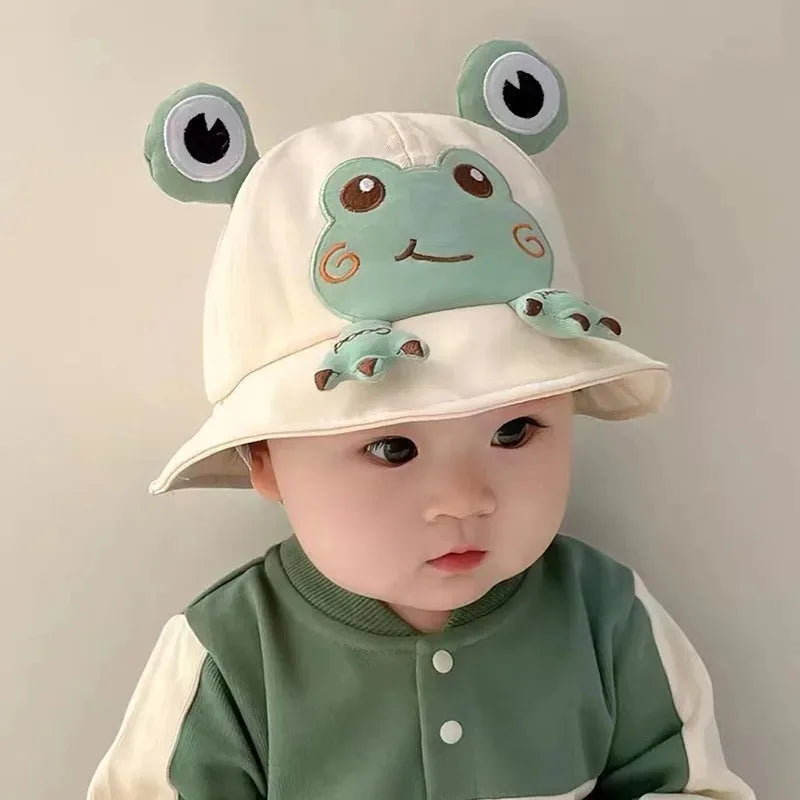 Adorable baby frog bucket hat in green, perfect for infant sun protection. Cute children's summer accessory.