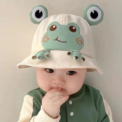 Baby frog bucket hat on a white background, highlighting its cute design and sun protection features.