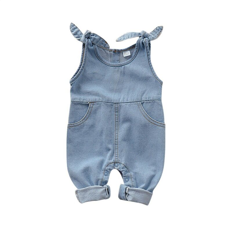 Close up of baby girl denim romper showcasing cute ruffle accents. Baby fashion.