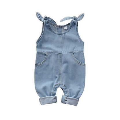Close up of baby girl denim romper showcasing cute ruffle accents. Baby fashion.