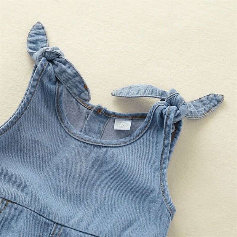 Infant girl's blue denim romper featuring charming ruffles, a must-have summer outfit.