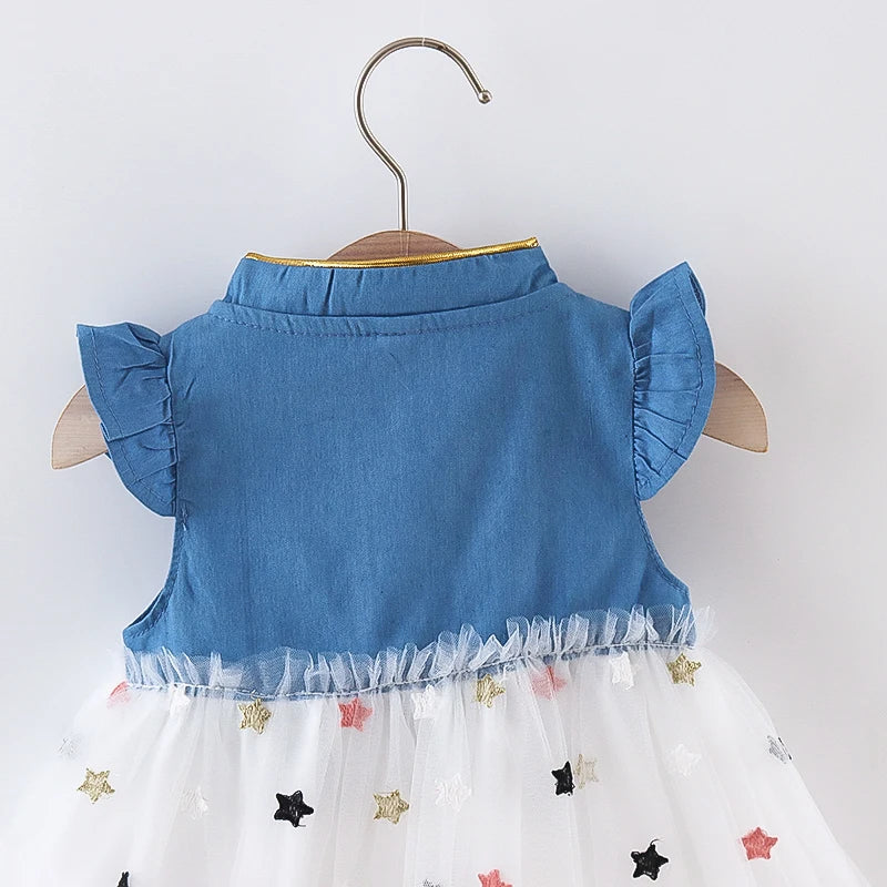 Front view of a baby girl's denim dress, designed with a decorative bow and elegant flying sleeves.