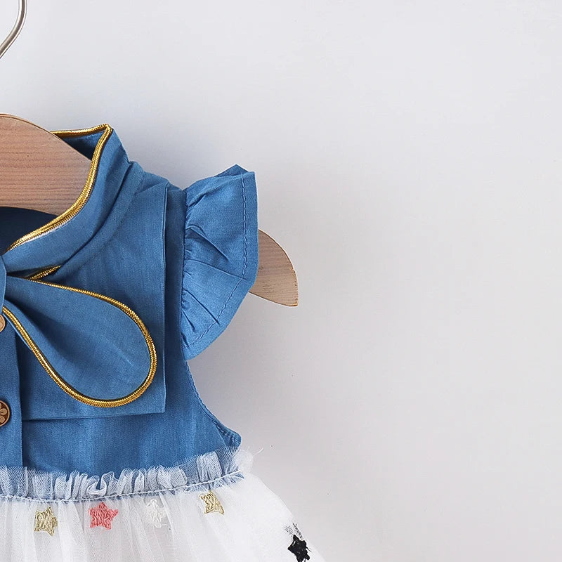 Cute kids clothing: Denim dress for girls featuring a prominent bow and stylish flying sleeves.