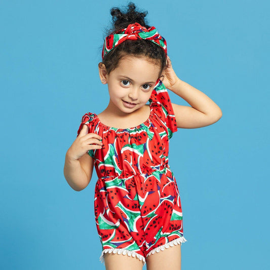 Adorable baby girl in a watermelon print swimsuit with a matching headband, perfect for summer beach wear