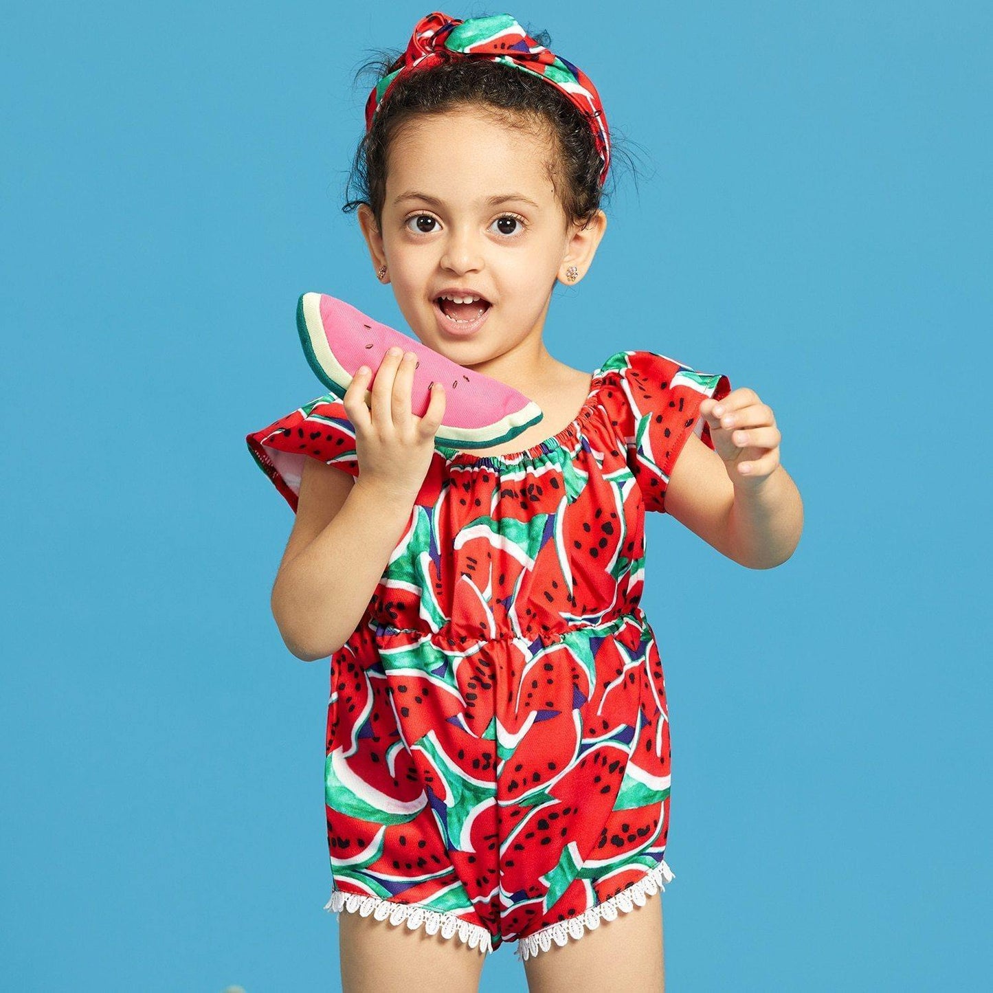 Cute infant girl's cotton blend swimsuit featuring a vibrant watermelon pattern, paired with a stylish headband