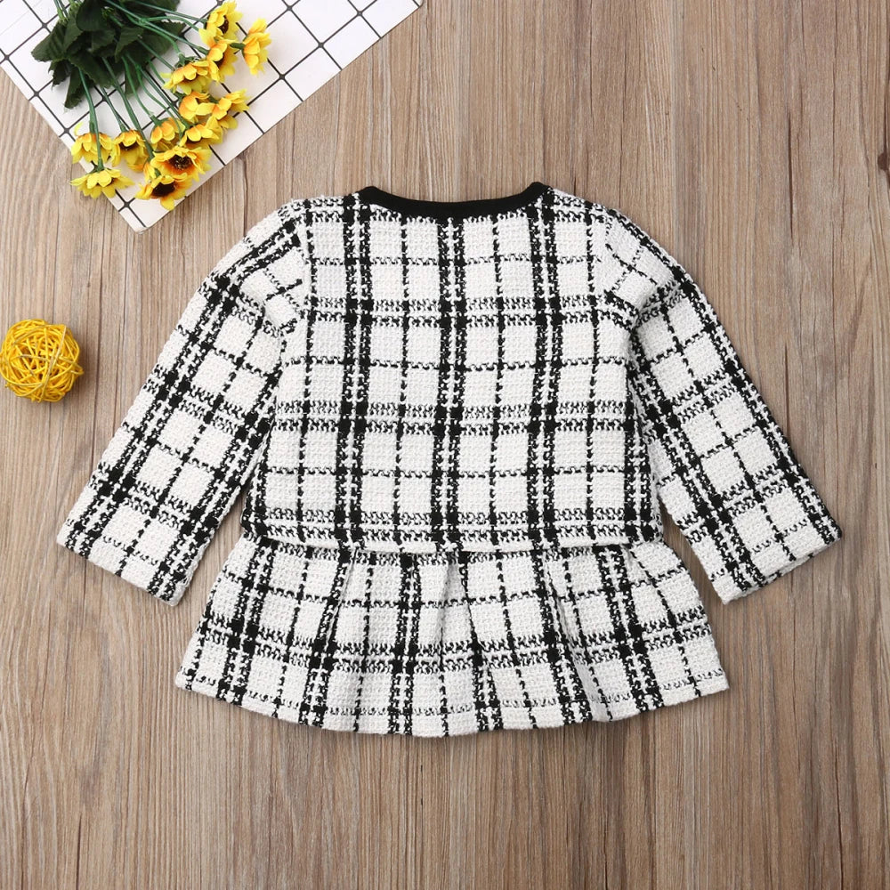 Baby girl's cozy red plaid coat, an essential piece for autumn and winter fashion