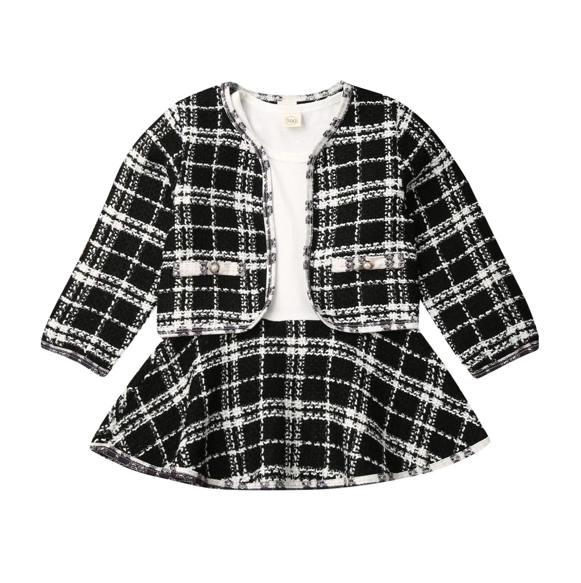 Full shot of a baby girl's party outfit featuring a plaid coat and tiered tutu dress