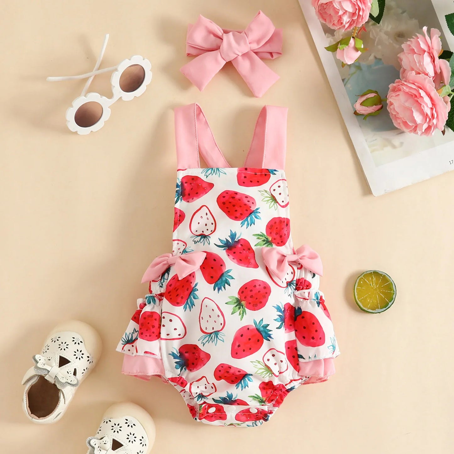 Girls' summer romper with sweet strawberry pattern and coordinating headband for baby fashion.
