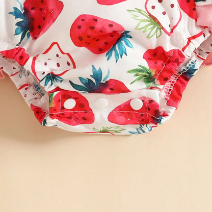 Charming infant girl's cow print bodysuit with a matching headband, a cute and trendy outfit.