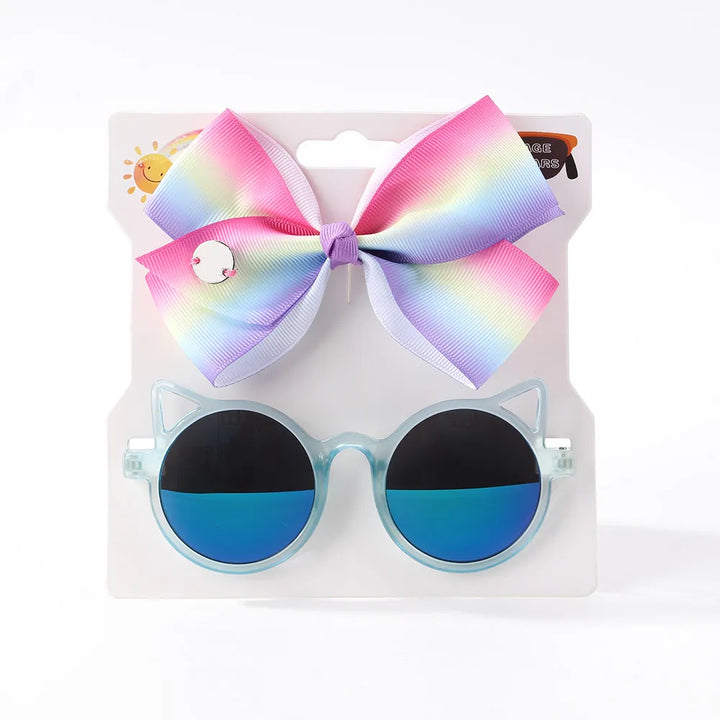 Adorable baby girl's hair accessories & eyewear: bow clip and cartoon sunglasses set.