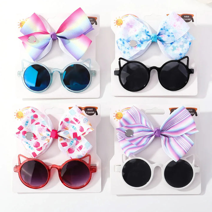 Cute baby girl's hair bow and cartoon character sunglasses, perfect infant accessory gift.