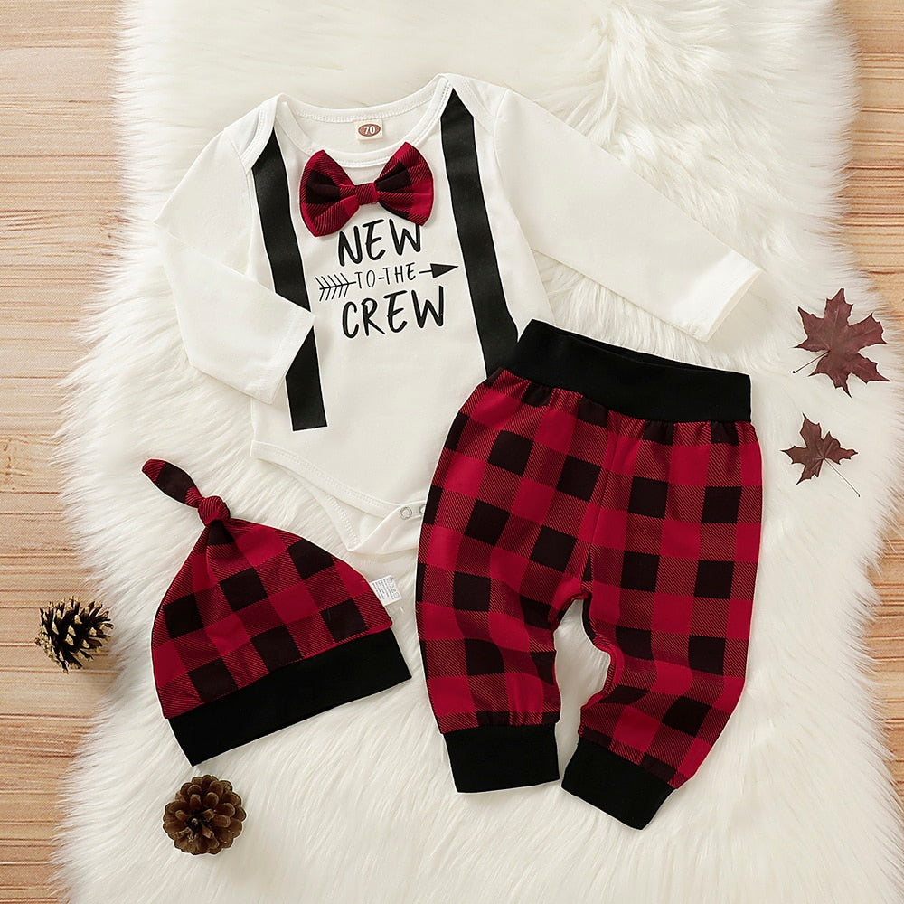 Adorable baby girl's first Halloween outfit with pumpkin bodysuit, striped pants, and matching hat.