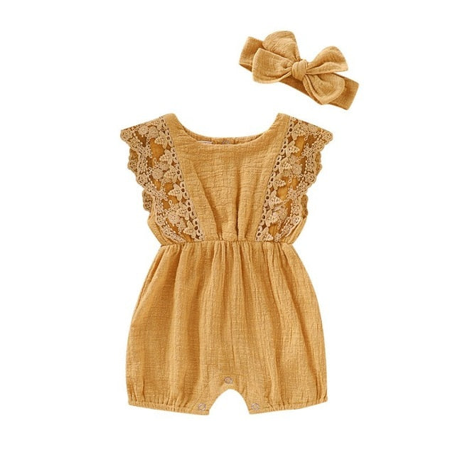 Full view of a baby girl's adorable summer cotton romper and bow headband, soft and stylish