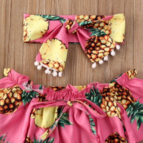 Adorable baby girl's sunflower pattern romper and elastic headband set. Sweet cotton summer fashion for infants.
