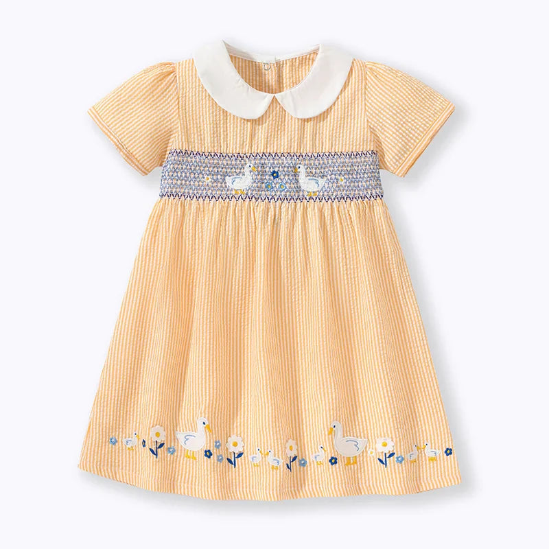 Adorable baby girl's yellow summer party dress with cute duck applique, perfect for toddlers.