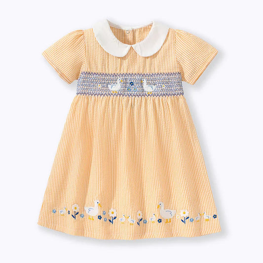 Adorable baby girl's yellow summer party dress with cute duck applique, perfect for toddlers.