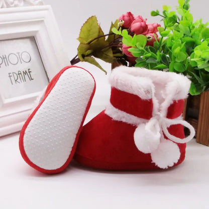 Cozy baby girl pink high boots, an essential winter accessory for keeping tiny feet toasty and secure.