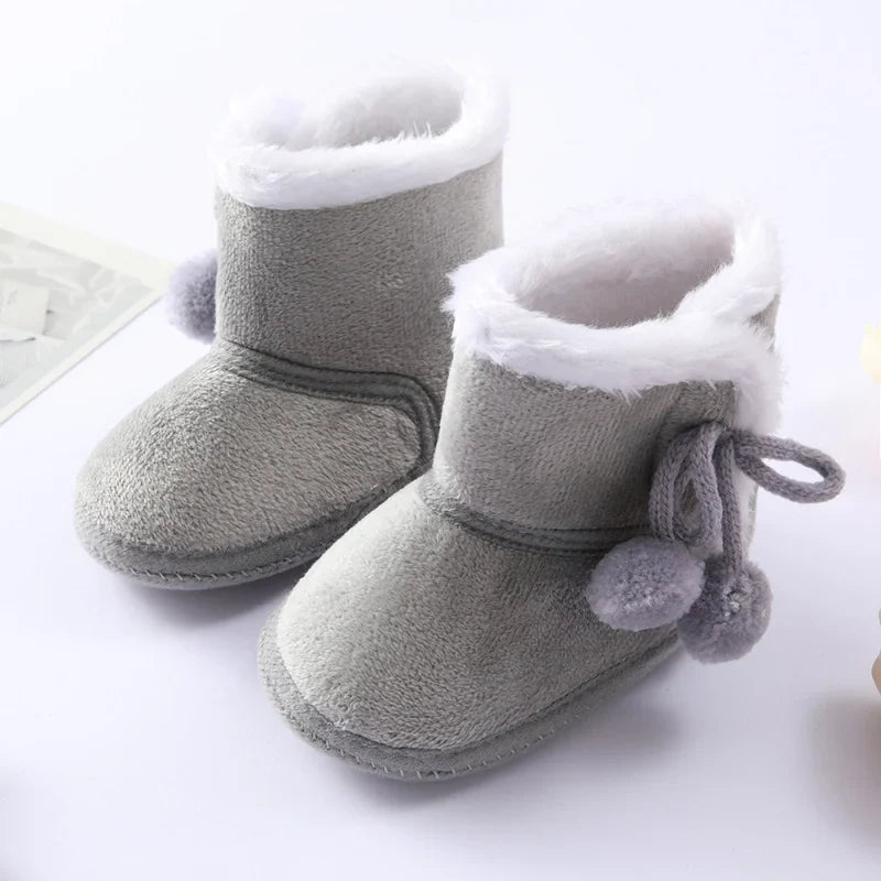 Durable pink baby girl winter high boots with plush interior, ensuring a snug fit and anti-slip stability.