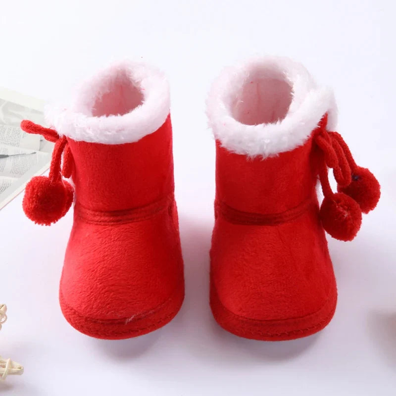 Warm pink baby girl winter boots with soft sole and anti-slip grip, ideal for snowy adventures.