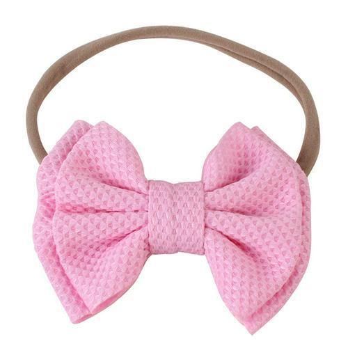 Baby girls' fashion with an elastic bow headband, a lovely infant hair accessory.