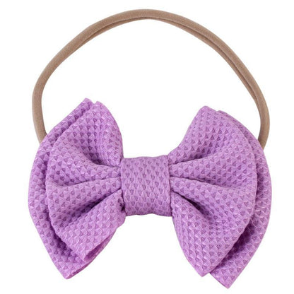 Colorful multi-pack of baby girls' elastic bow headbands for infant fashion.