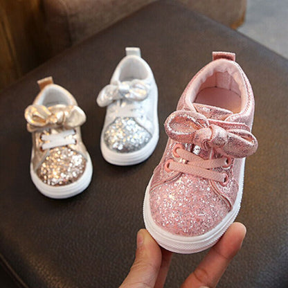Adorable baby girls' pink glitter bowknot first walker sneakers with comfy sole.