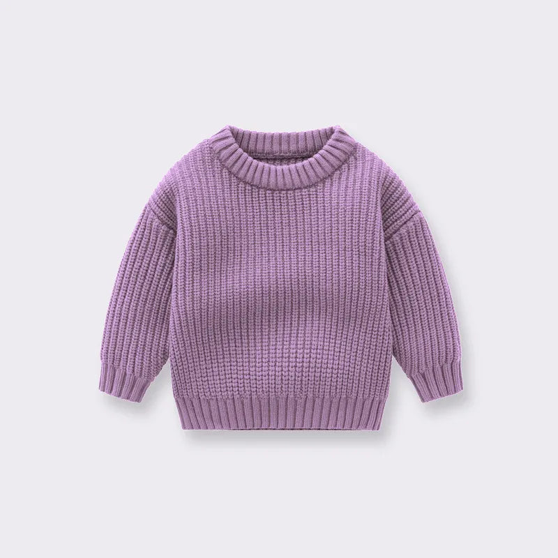 Toddler in a comfortable knitted sweater, a perfect addition to autumn winter baby clothing.