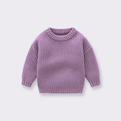 Toddler in a comfortable knitted sweater, a perfect addition to autumn winter baby clothing.