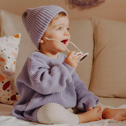 Loose fit knitted sweater for baby, offering warmth and flexibility for autumn winter play.