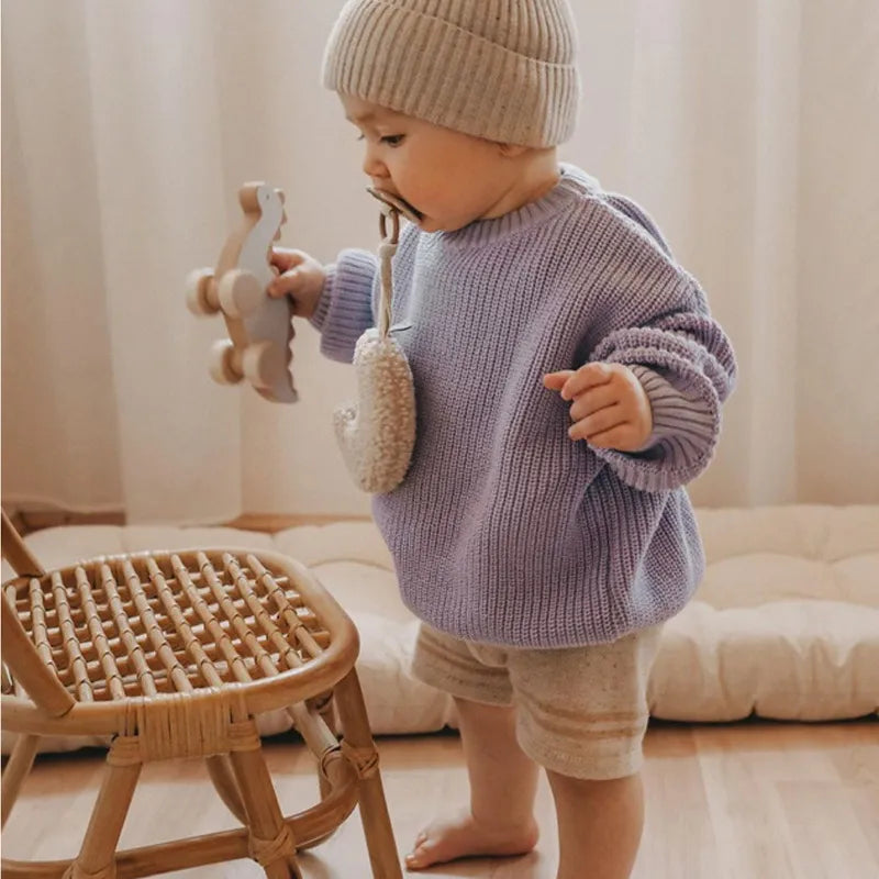Baby fashion essential: A soft knit loose sweater designed for autumn winter comfort and style.