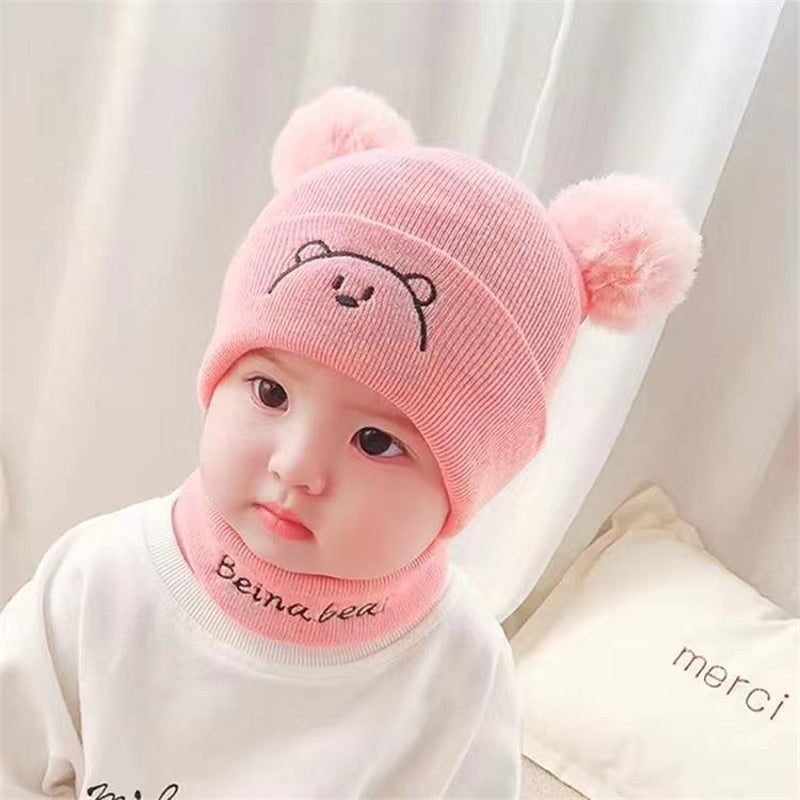 Cute baby gift set: A soft knit hat and scarf, perfect new baby accessories for chilly weather.